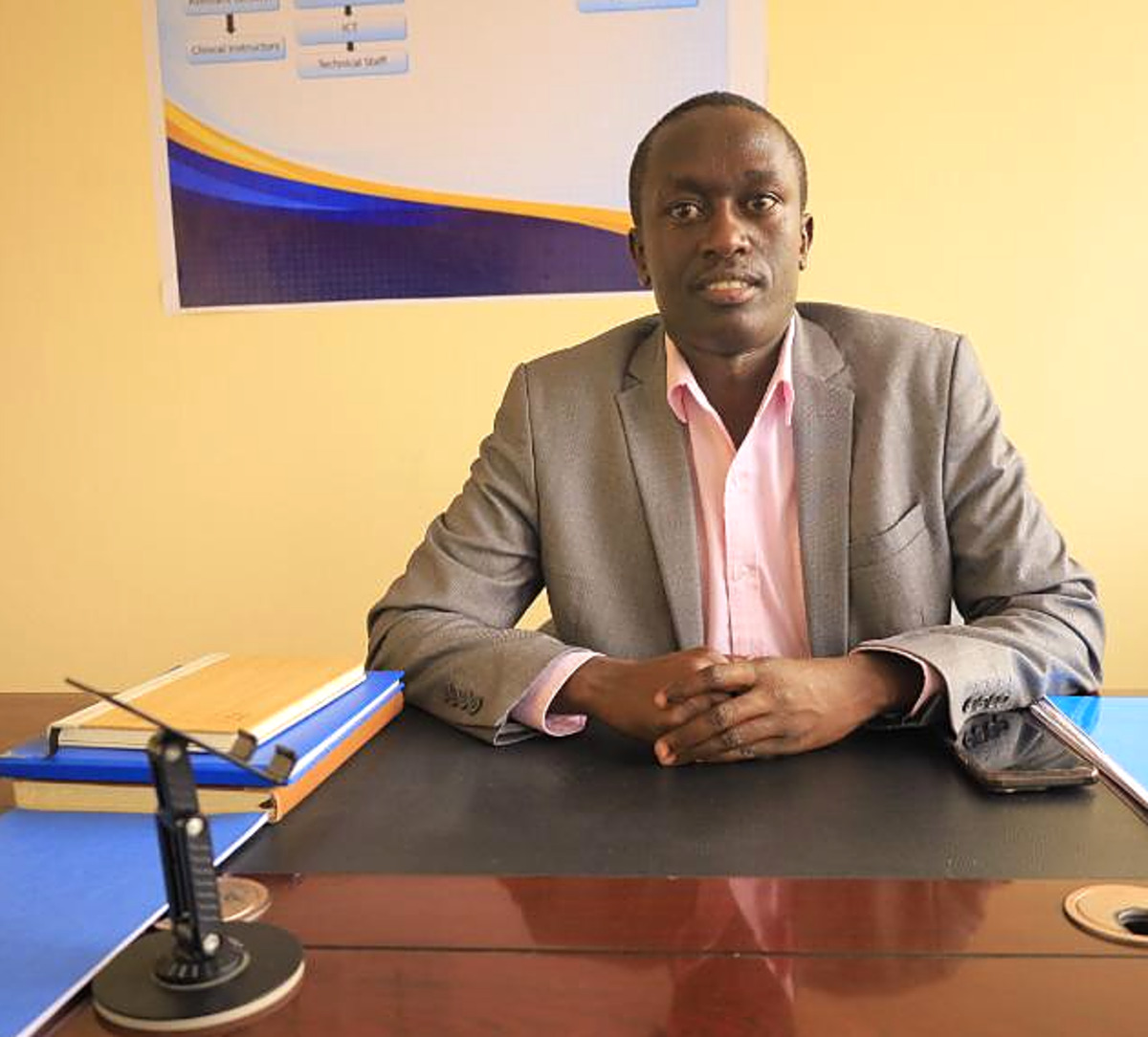 Topmax Training College Director in his office